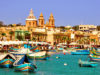 Harbour of Marsaxlokk village in Malta with colourful fishing boats