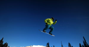 A snowboarder takes flight on Whistler Mountain.