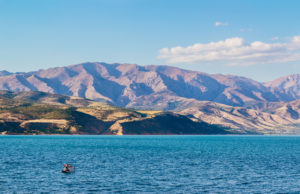 The view of Lake Charvak or reservoir with mountains in the background, Tashkent province, Uzbekistan