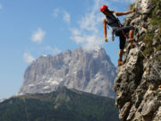 Young woman climbing in the Dolomits, Italy