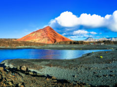 Unique volcanic nature of Lanzarote island with black sands and red mountains