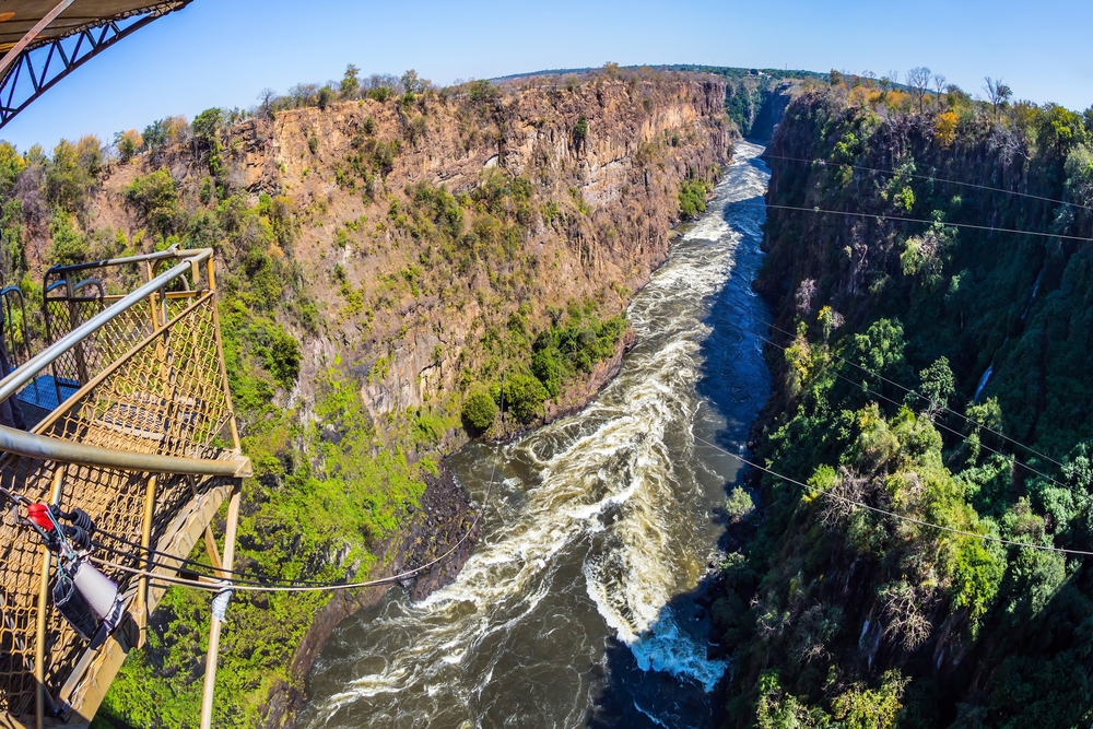 The famous Victoria Falls in Zambia. Bungee jumping from a bridge near waterfall