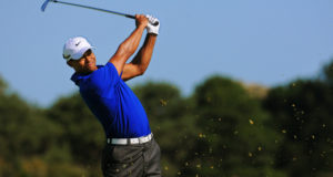 SYDNEY - NOV 12: American golfer Tiger Woods plays from the rough, third round at the Emirates Australian Open at The Lakes golf course. Sydney - November 12, 2011